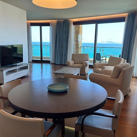 Smy Carlos V Wellness & Spa Alghero Exterior photo A living room in a suite at the Westin Resort Costa Navarino