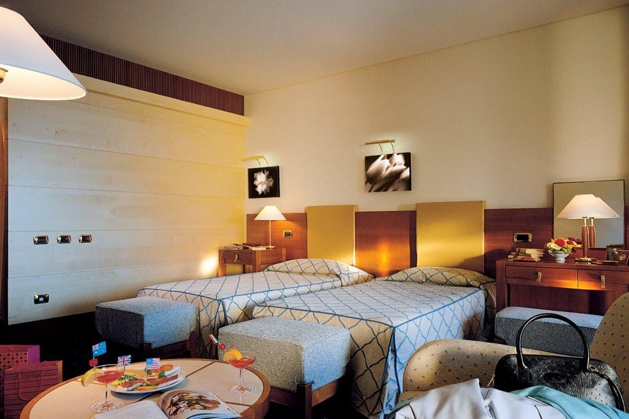 Smy Carlos V Wellness & Spa Alghero Exterior photo A room at the hotel