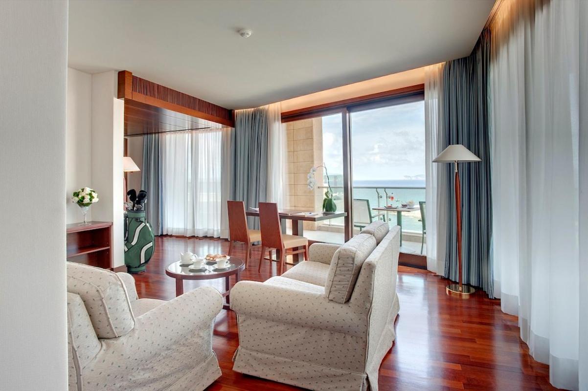 Smy Carlos V Wellness & Spa Alghero Exterior photo A suite at the hotel