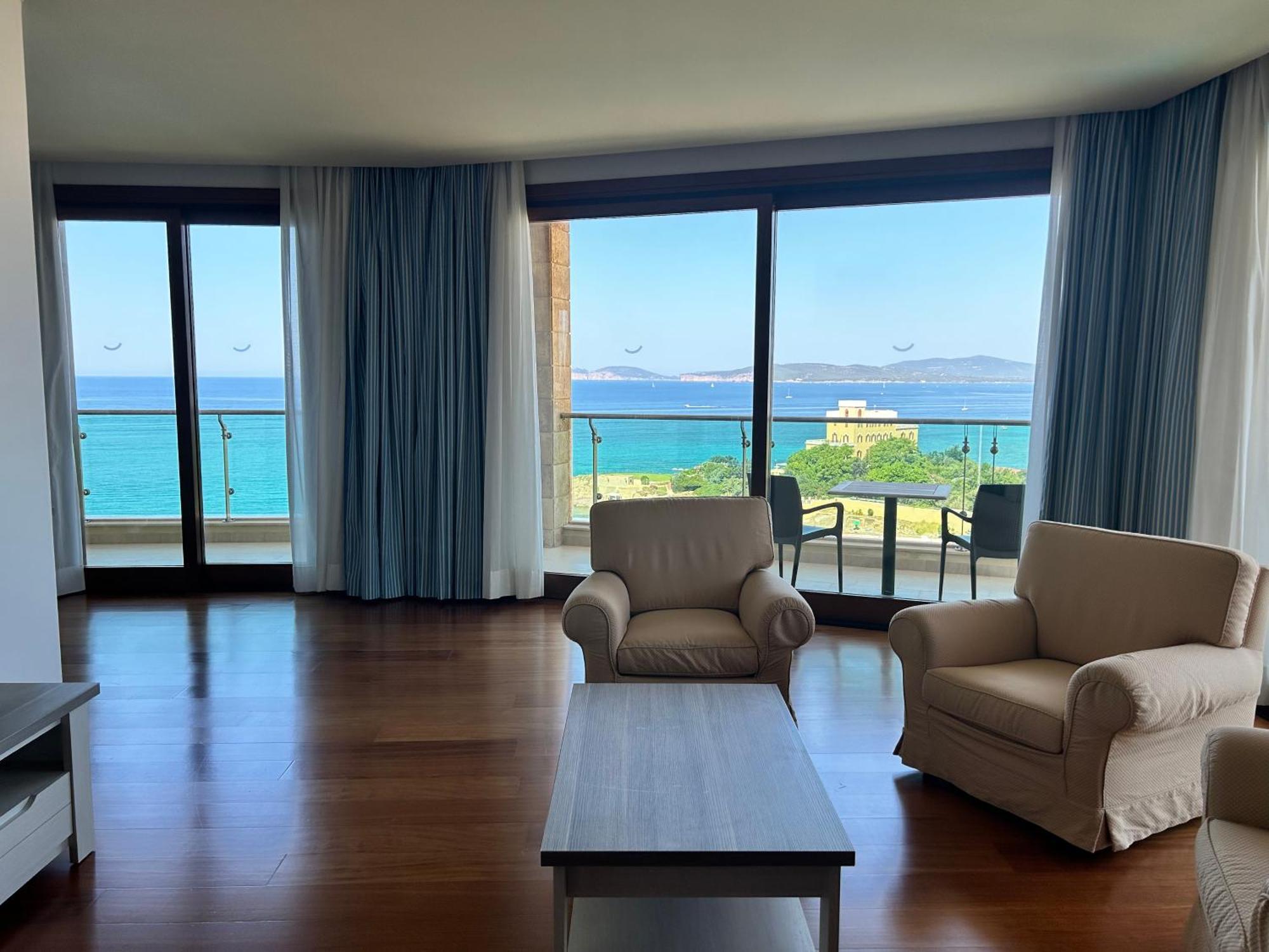 Smy Carlos V Wellness & Spa Alghero Exterior photo A living room in a hotel